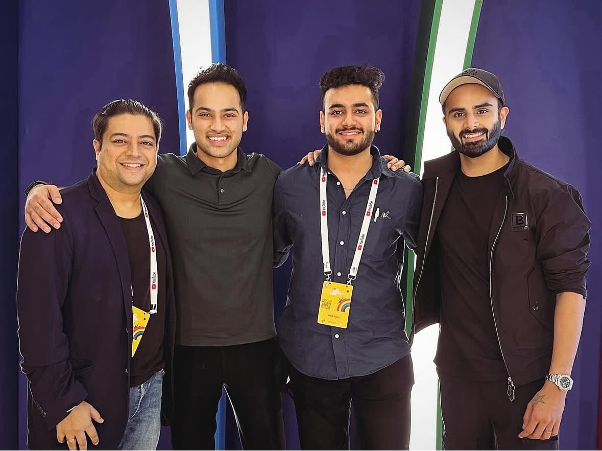 Four members of the NB Media team at an industry event